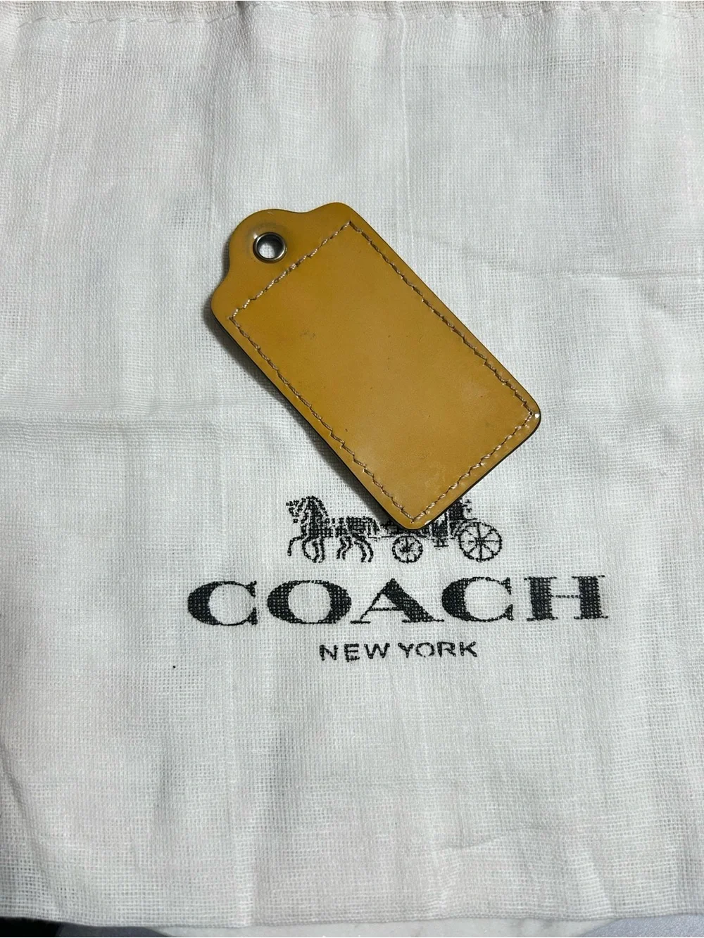 Coach Mustard Leather hang tag